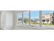 Bright living room with large windows offering neighborhood views and natural light at 3007 Mirage Pl, St Cloud, FL 34771