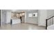 Open-concept living room features an island kitchen and tiled floors at 3007 Mirage Pl, St Cloud, FL 34771