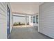 Spacious outdoor patio with a stamped concrete floor and white pillars at 3007 Mirage Pl, St Cloud, FL 34771