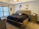 Spacious main bedroom with a coastal style painting and ensuite bathroom at 2819 Ne 25Th St, Ocala, FL 34470