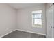 Clean, carpeted room with neutral paint, a window, and a white door with hardware at 5429 Sw 85Th Avenue Rd, Ocala, FL 34481