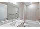 Well-lit bathroom featuring a single vanity with white countertops, tiled walls, and a bathtub/shower combination at 5813 Sw 87Th Court Rd, Ocala, FL 34481