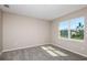 Bright bedroom with natural light from a large window and neutral carpet at 5813 Sw 87Th Court Rd, Ocala, FL 34481