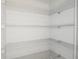 Walk-in pantry with white wire shelving for optimized storage and organization at 5813 Sw 87Th Court Rd, Ocala, FL 34481