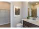 Bathroom with dark vanity, quartz countertop, and shower/tub combo at 8319 Sw 54Th Loop, Ocala, FL 34481