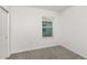 Light filled bedroom featuring neutral carpet, a closet, and a window at 8319 Sw 54Th Loop, Ocala, FL 34481