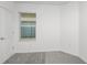 Bright bedroom featuring a window for natural light and neutral gray carpeting at 8319 Sw 54Th Loop, Ocala, FL 34481