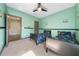 Light green bedroom with twin beds and playful decor at 9406 Dugard Ct, Orlando, FL 32827