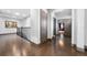 Upstairs hallway with dark wood floors and access to bedrooms at 9406 Dugard Ct, Orlando, FL 32827