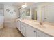 Bathroom features a dual sink vanity, soaking tub, and separate glass shower at 4995 County Road 121D, Wildwood, FL 34785