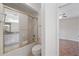Full bathroom featuring a shower-tub combination, white toilet, and neutral vanity at 4995 County Road 121D, Wildwood, FL 34785