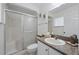 Bathroom with granite vanity, shower-tub combination, and sliding glass door at 4995 County Road 121D, Wildwood, FL 34785