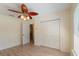 Bedroom featuring a decorative ceiling fan, and hardwood floors at 4995 County Road 121D, Wildwood, FL 34785