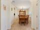 Dining room with a wood table and chairs and traditional hutch at 4995 County Road 121D, Wildwood, FL 34785