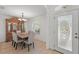 Elegant dining room featuring a modern table and chairs with a decorative hutch at 4995 County Road 121D, Wildwood, FL 34785