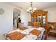 Bright dining room with view into kitchen area at 4995 County Road 121D, Wildwood, FL 34785