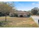 Spacious single-Gathering home with a well-manicured front yard at 4995 County Road 121D, Wildwood, FL 34785