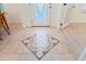 Foyer with decorative tile inlay and decorative glass entry door at 4995 County Road 121D, Wildwood, FL 34785