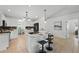 Bright kitchen with sleek countertops, stainless steel appliances, and a breakfast bar with seating at 4995 County Road 121D, Wildwood, FL 34785