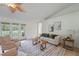 Bright living room featuring neutral tones, stylish furniture, and access to the backyard at 4995 County Road 121D, Wildwood, FL 34785