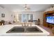 Open living area features stylish furnishings and plenty of natural light from expansive windows at 4995 County Road 121D, Wildwood, FL 34785