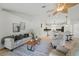 Bright and inviting living room with modern furnishings and an open layout to the kitchen at 4995 County Road 121D, Wildwood, FL 34785