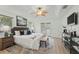 Relaxing main bedroom with a tray ceiling, stylish decor, and access to a private outdoor space at 4995 County Road 121D, Wildwood, FL 34785