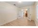 Bright office with light wood floors and French doors leading to the dining room at 4995 County Road 121D, Wildwood, FL 34785