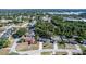 Wide aerial showcasing the home and surrounding community near a lake at 1309 Buccaneer Ave, Deltona, FL 32725