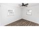 Well-lit bedroom with two windows and wood floors at 1309 Buccaneer Ave, Deltona, FL 32725