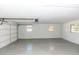 Attached garage with painted concrete floor and automatic opener at 1309 Buccaneer Ave, Deltona, FL 32725