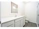 Clean bathroom with white vanity, walk-in shower, and grey flooring at 13454 Leaping Water Way, Astatula, FL 34705