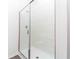 Modern shower with frameless glass enclosure and white tile at 13454 Leaping Water Way, Astatula, FL 34705