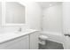 Bathroom with white cabinets, quartz countertop and bathtub at 13481 Leaping Water Way, Astatula, FL 34705