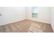 Spacious bedroom with neutral carpeting and large window at 13481 Leaping Water Way, Astatula, FL 34705