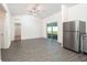 Open dining area with wood-look flooring and ceiling fan at 13481 Leaping Water Way, Astatula, FL 34705