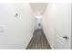 Bright hallway with wood-look flooring and neutral walls at 13481 Leaping Water Way, Astatula, FL 34705