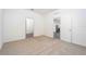 Bedroom featuring neutral carpet and two doorways leading to other parts of the home at 13489 Leaping Water Way, Astatula, FL 34705