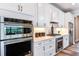 Modern kitchen featuring stainless steel appliances and white cabinets at 6019 Sw 86Th Cir, Ocala, FL 34481