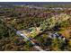 Expansive lot featuring a home surrounded by lush greenery and mature trees at 2468 Fawn Run, Oviedo, FL 32765