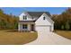 Charming modern farmhouse with a well-manicured lawn, spacious garage, and elegant curb appeal at 2468 Fawn Run, Oviedo, FL 32765