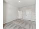Spacious bedroom featuring plush gray carpeting and ample natural light at 6074 Sacred Oak Ave, Mount Dora, FL 32757