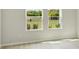 Bedroom with view of the outdoors at 6074 Sacred Oak Ave, Mount Dora, FL 32757