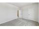 Bedroom featuring neutral walls and gray carpeting at 6074 Sacred Oak Ave, Mount Dora, FL 32757