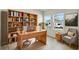 Inviting home office with built-in bookshelves and natural light at 6074 Sacred Oak Ave, Mount Dora, FL 32757