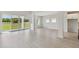 Bright, open living area with large sliding glass doors and views of the outdoors at 6074 Sacred Oak Ave, Mount Dora, FL 32757