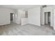 Bright loft area with neutral paint, carpet flooring, and multiple entryways at 6074 Sacred Oak Ave, Mount Dora, FL 32757