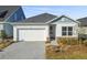New construction home, one-story, gray and white exterior at 5938 Bristle Oak St, Mount Dora, FL 32757
