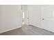 Spacious bedroom with carpet flooring and access to other rooms at 5938 Bristle Oak St, Mount Dora, FL 32757