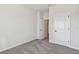 Spacious bedroom with carpet flooring and access to other rooms at 5938 Bristle Oak St, Mount Dora, FL 32757